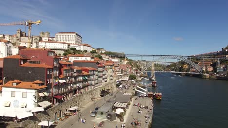 Aerial-View-of-Porto-with-Famous-Dom-Luis-I-Bridge,-River-Douro-and-Ribeira-Houses,-Portugal