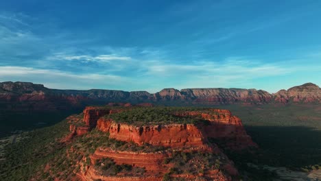 Sedona-Red-Rock-Mountain-Valley-Against-Cloudy-Sky---aerial-drone-shot