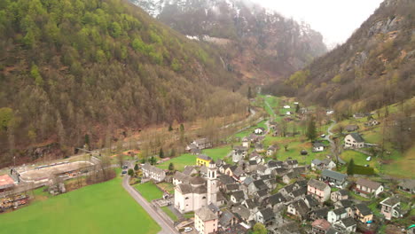 Sonogno-Village-In-Scenic-Landscape,-Verzasca-Valley-Near-Locarno,-Ticino-Canton,-Switzerland---aerial-drone-shot