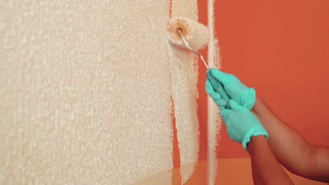 Close-Shot-Of-Someone-Using-Painting-Roll-To-Paint-Wall-In-White