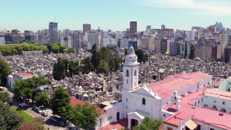 Aerial-orbit-of-the-Recoleta-Cemetery-and-the-Basílica-de-Nuestra-Señora-del-Pilar-on-a-sunny-day,-view-of-mausoleums-and-tombs