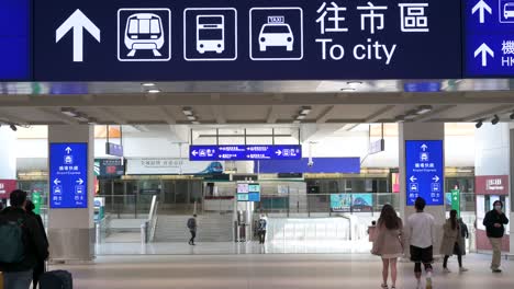 Passengers-and-travelers-are-seen-exiting-Hong-Kong's-Chek-Lap-Kok-International-Airport-as-they-take-a-ride-to-downtown-Hong-Kong