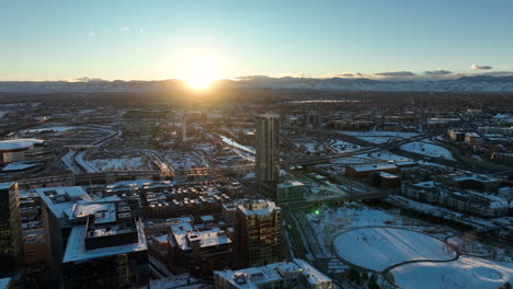 Aerial-drone-shot-of-sunset-moving-around-over-Commons-Park,-Denver