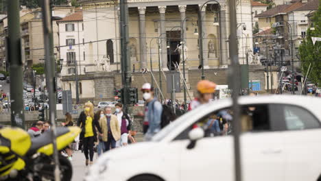 Heavily-zoomed-in-slow-motion-shot-of-people-and-architecture-in-Turin