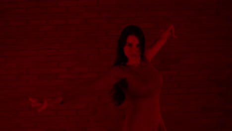Talented-female-dancer-dancing-in-a-red-room