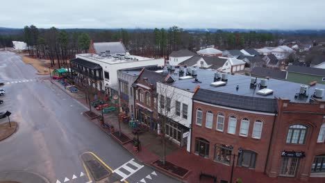 Aerial-orbit-of-charming-small-town-brick-shops-and-eateries-at-Moss-Rock-Preserve-in-Hoover,-Alabama