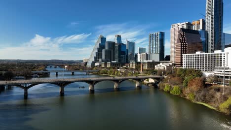 Traffic-on-the-Congress-Avenue-Bridge,-sunny,-fall-day-in-Austin,-USA---Aerial-view