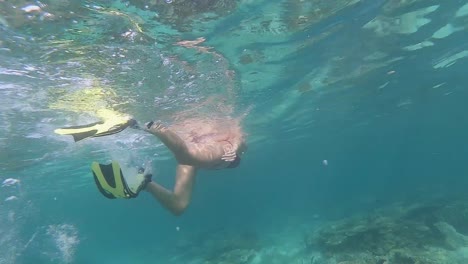 Girl-snorkeling-with-fins-in-slow-motion