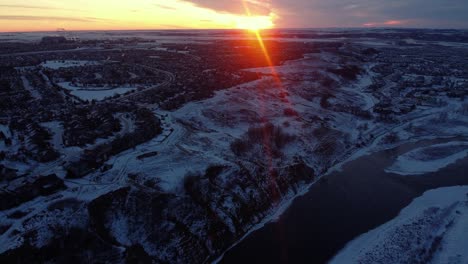 Aerial-shots-of-Calgary's-houses-during-a-beautiful-winter-sunrise-with-snow