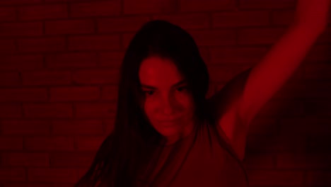Close-up-face-of-a-female-dancer-dancing-in-the-red-room