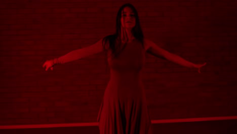 Fast-and-energetic-dancer-dancing-in-red-lit-room