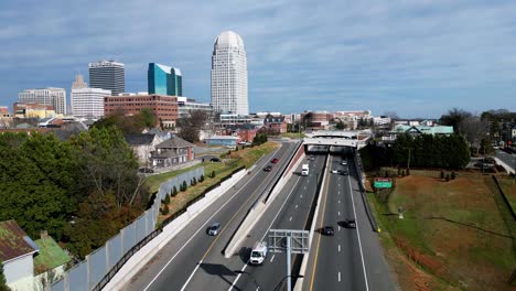 Winston-Salem-North-Carolina-Aerial-of-business-40-with-skyline-in-shot