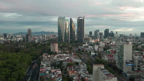 Aerial-View-of-Morning-Traffic-and-Towers-of-Mexico-City,-Streets-and-Buildings,-Establishing-Drone-Shot