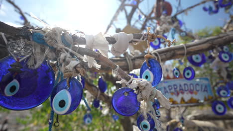 Evil-Eye-Souvenirs-Hanging-on-Tree,-Traditional-Handcraft-From-Cappadocia,-Turkey,-Close-Up