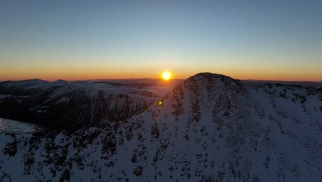 Drone-shot-from-Musala-peak-during-sunrise,-Bulgaria,-Rila-mountain,-highest-peak-on-the-Balkans,-golden-hour,-blue-hour,-dawn
