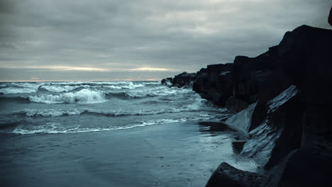 Powerful-Iceland-Storm-Waves-Crashing-against-Stone-Rock-Cliffs