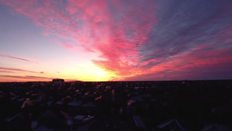 Flying-drone-in-Calgary-during-a-beautiful-winter-sunrise-with-real-estate