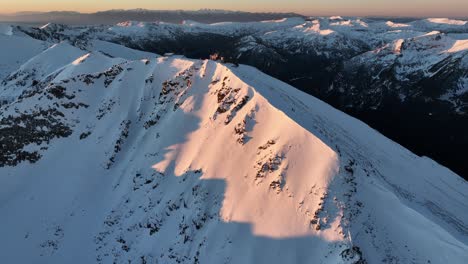 Drone-shot-to-Musala-peak-during-sunrise,-Bulgaria,-Rila-mountain,-highest-summit-on-the-Balkans,-golden-hour,-blue-hour,-dawn