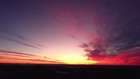 Flying-drone-in-Calgary-during-a-beautiful-sunrise-over-the-mountains-in-winter