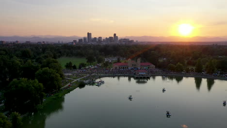 Wide-aerial-shot-pushing-towards-Denver's-City-Park-Pavilion-with-an-outdoor-jazz-festival-taking-place-in-the-summer