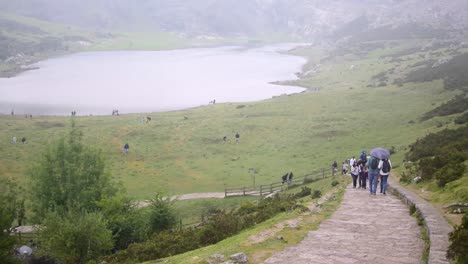 Covadonga-Lakes,-August-29,-2022,-Spain:-Hiking-in-Lagos-de-Covadonga-or-Covadonga-Lakes,-surrounded-by-mountains,-lakes-and-cows,-in-Spain