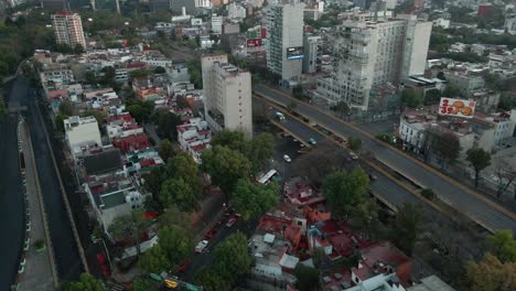 Aerial-View-of-Early-Morning-Traffic-in-Downtown-Neighborhood-of-Mexico-City,-Drone-Shot