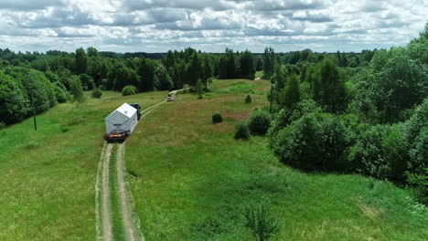 Transporting-a-prefabricated-cabin-to-a-wilderness-location---aerial-view