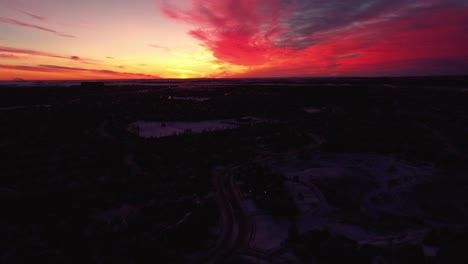 Drone-footage-of-Calgary's-houses-during-a-beautiful-winter-sunrise-with-god-rays