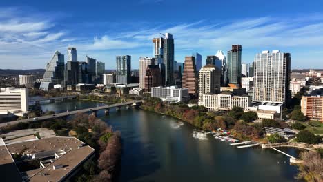 Aerial-view-around-the-riverside-skyline-of-Austin,-sunny-autumn-day-in-TX,-USA