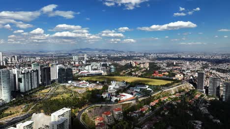 Aerial-view-overlooking-the-La-Mexicana-Park,-sunny-day-in-Santa-Fe,-Mexico-city