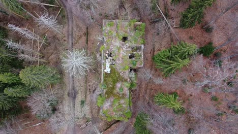Top-down-aerial-of-abandoned-hospital-building-in-the-mountain-forest-of-Zagreb,-Croatia