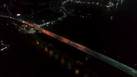 Drone-shot-of-a-bridge-at-night