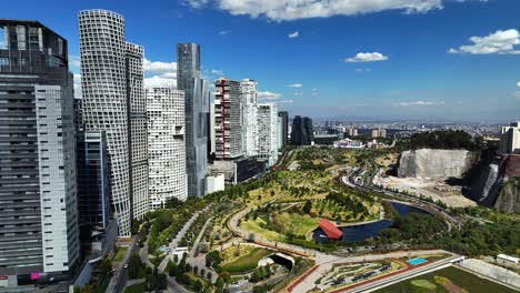Tall-apartments-and-the-La-Mexicana-in-sunny-Santa-Fe,-Mexico-city---aerial-view