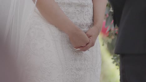 Brides-hands-shaking-during-wedding-ceremony