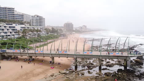 Drone-track-along-Umhlanga-Pier-revealing-the-Pearl-residences-and-hotel-in-Durban