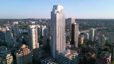 Fly-over-Vancouver's-bustling-downtown-with-stunning-aerial-footage-of-Burrard-Street's-towering-skyscrapers-and-bustling-city-life-in-BC,-Canada