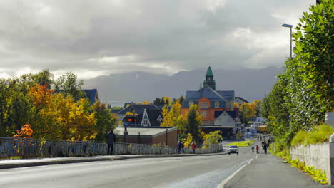 Walking-On-The-Historical-Town-Of-Tromso-On-A-Cloudy-Day-During-Autumn-Season-In-Norway