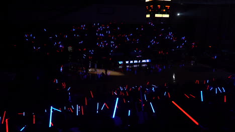 crowd-with-blue-and-red-light-sabers