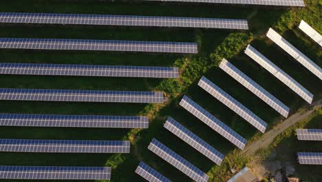 Top-down-aerial-of-Photovoltaic-Power-Station,-rising-orbit-reveals-solar-farm