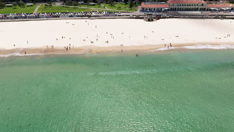 Beautiful-Turquoise-Water-On-Iconic-Bondi-Beach-With-People-Enjoying-Summer-Day