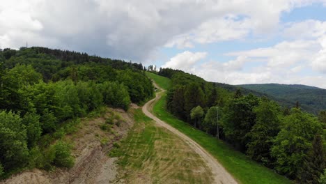 Hiking-trail-to-Jaworzyna-Krynicka-summit-on-summer-day,-Beskid-moutain,-Poland,-aerial