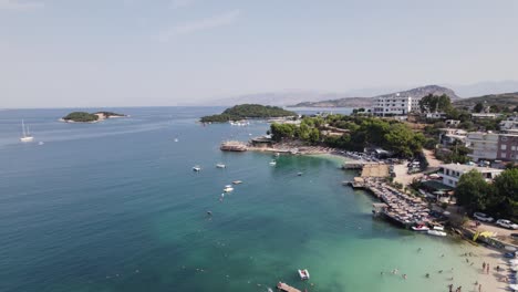 Aerial-View-Off-Plazhi-Ksamil-9-With-Boats-Moored-In-Bay