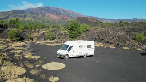 RV-Motorhome-sleeping-spot-at-Mount-Etna-Volcano-in-Sicily,-Italy---Aerial-4k