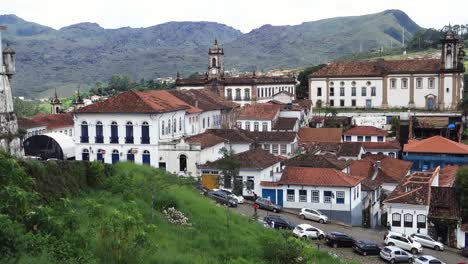 panning-view-of-old-buildings-and-baroque-style-architecture-of-Ouro-Preto,-former-colonial-mining-town-in-Minas-Gerais,-Brazil
