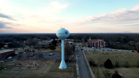 small-town-water-tower-aerial-orbit-in-clemmons-north-carolina