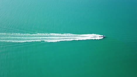 luxury-boat-aerial-view,-luxurious-yacht-moving-fast-in-blue-sea
