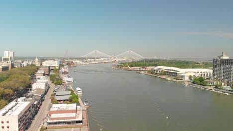 Aerial-view-the-savannah-river-with-buildings-lined-up-of-both-sides-of-the-river-banks