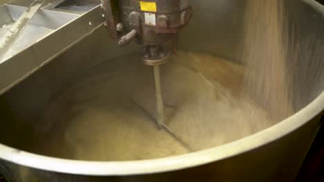 Mashing-the-grain-and-liquor-in-the-mash-tun-where-brewing-beer
