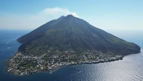 Stromboli-Volcano-Island-Village-and-Active-Smokes-at-Aeolian-Islands,-Italy---Aerial-4k