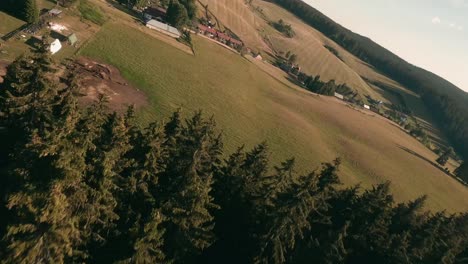 Dynamic-flight-footage-from-racing-drone-moving-fast-in-between-the-tree-tops-of-a-beautiful-spruce-forest-in-Sihla,-Central-Slovakia